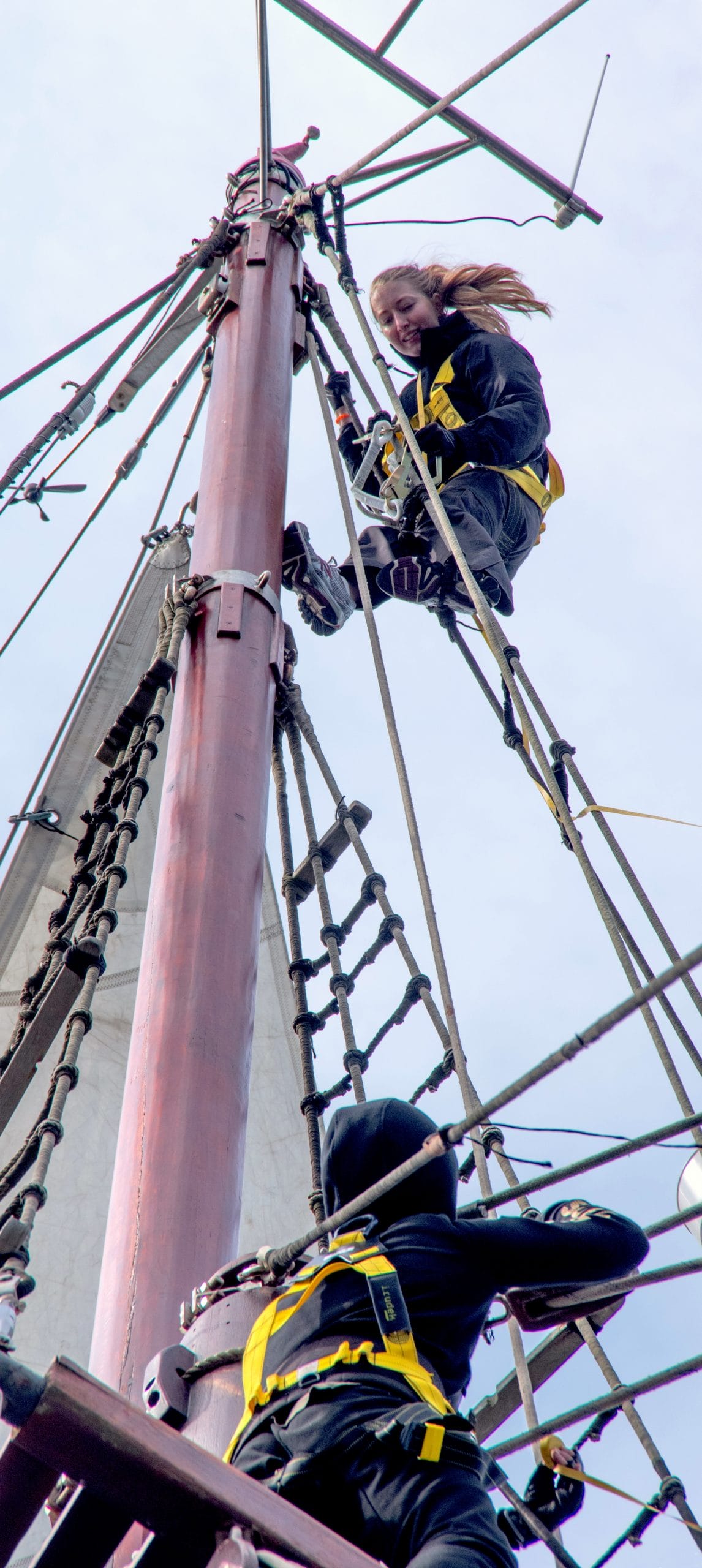 Crew members on the rigging masts Atyla ship Foundation sailing adventure wind harnesses irudek